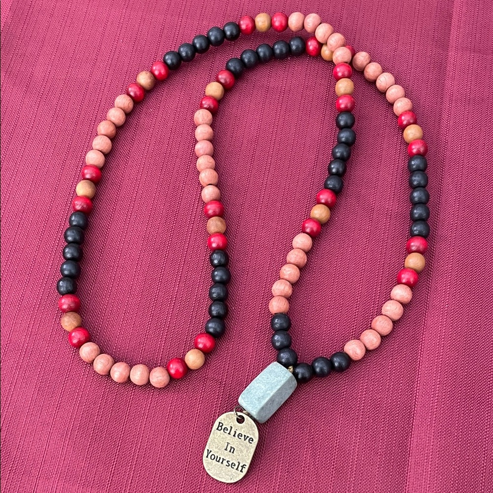 Hand assembled beaded necklace with metal pendant believe in yourself